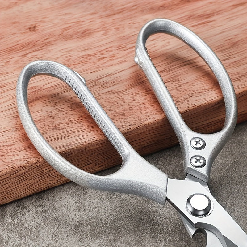 Sharp stainless steel kitchen scissors designed for home use, perfect for cutting through chicken, duck, and fish bones. Features a convenient fish scale scraper and is a helpful accessory for any small kitchen tool collection.