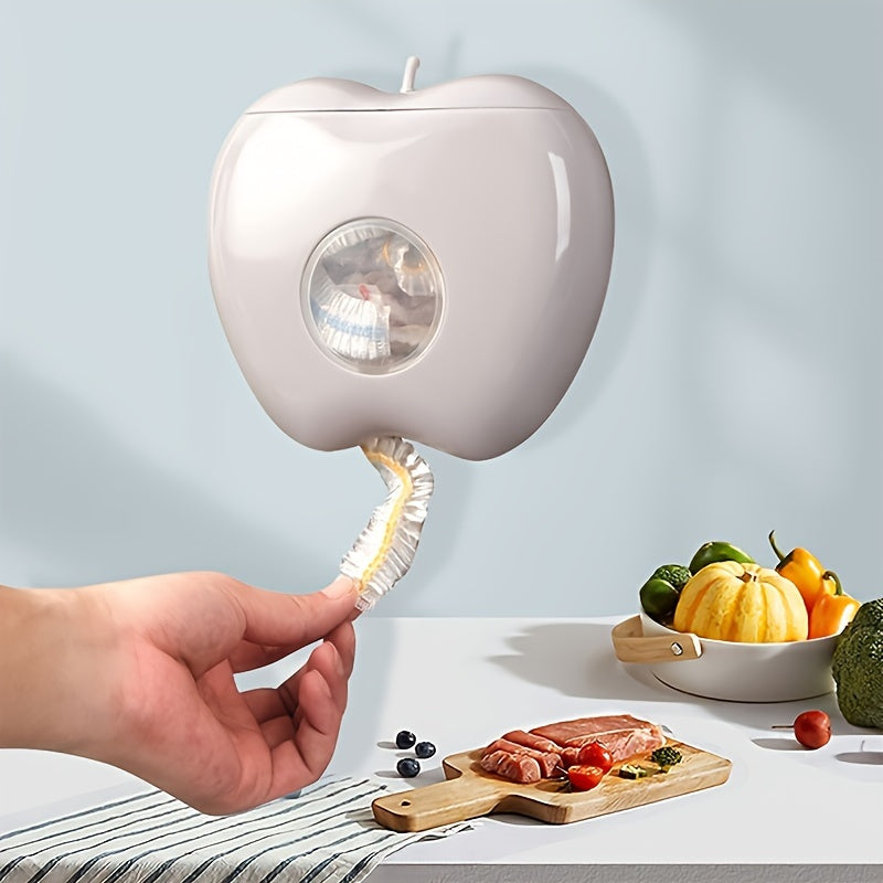 Wall-mounted plastic bag holder in the shape of an apple, perfect for storing disposable food covers. Keep your kitchen and bathroom accessories organized with this elastic fresh-keeping bag organizer. This item is designed for non-food contact.