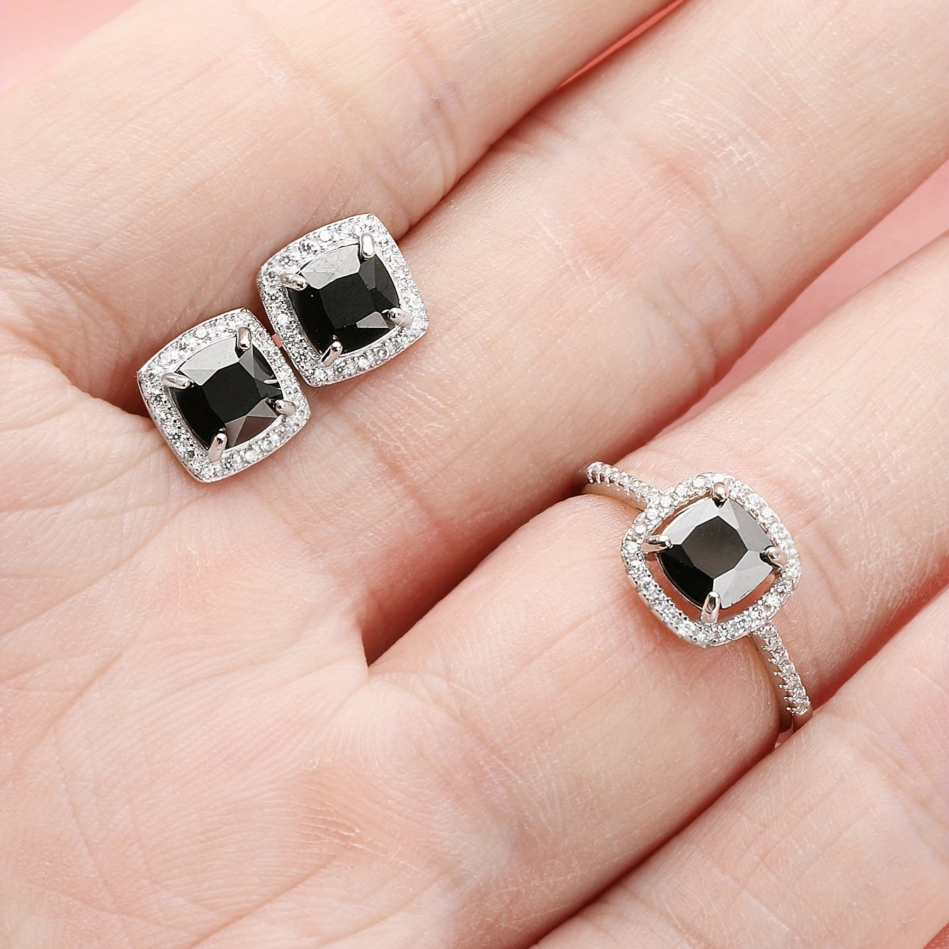 Set of elegant jewelry comprising of three pieces - two earrings and one ring, made of 925 sterling silver and inlaid with black zircon. This set symbolizes romance and mystery, making it perfect for parties and special occasions. The total weight of