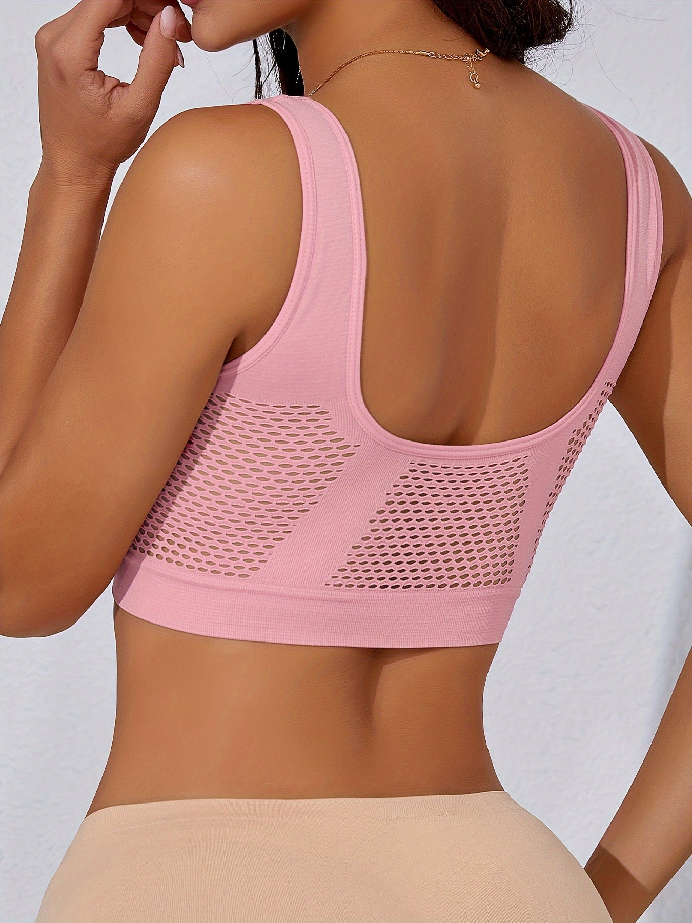 4 high-support sports bras for women, perfect for running and yoga, with breathable no-wire design and hollow-out detail.