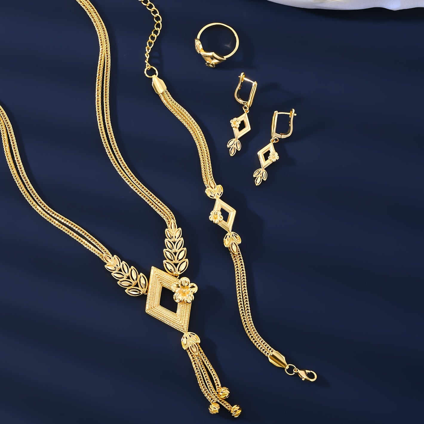 Vintage & Sexy Style 18K Golden Plated Copper Jewelry Set for Women, including Wedding Bridal Necklace, Bracelet, Ring, and Earrings. This all-season set is perfect for daily wear and gift giving.