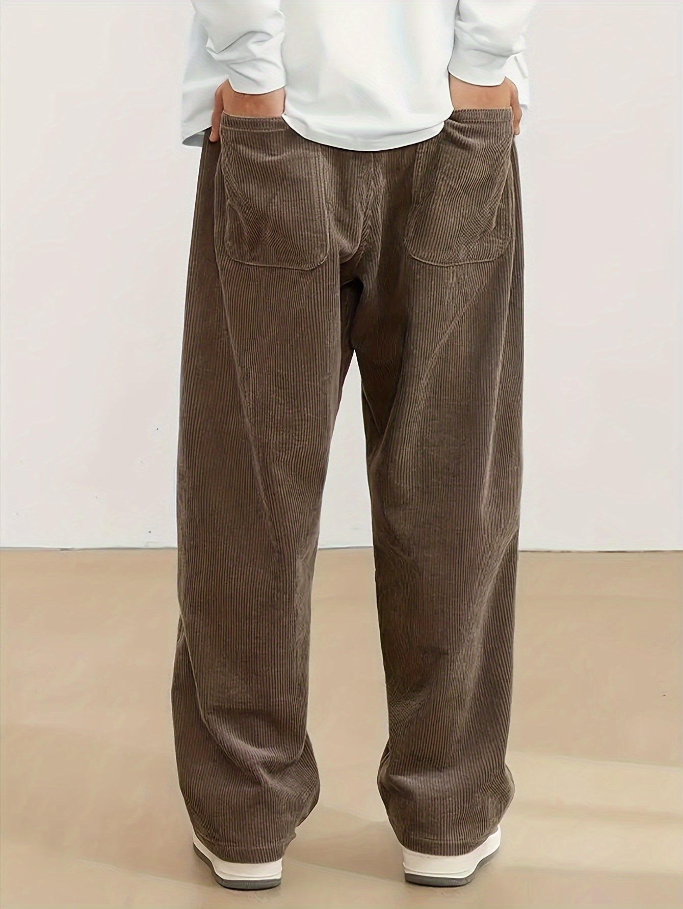 Men's casual corduroy pants with drawstring waist, ideal for outdoor activities and commuting.