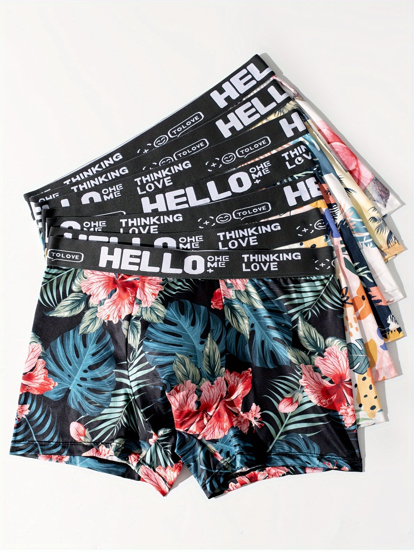 7-pack of men's boxer briefs with soft and stretchy fabric, featuring trendy floral prints and a comfortable, breathable fit.