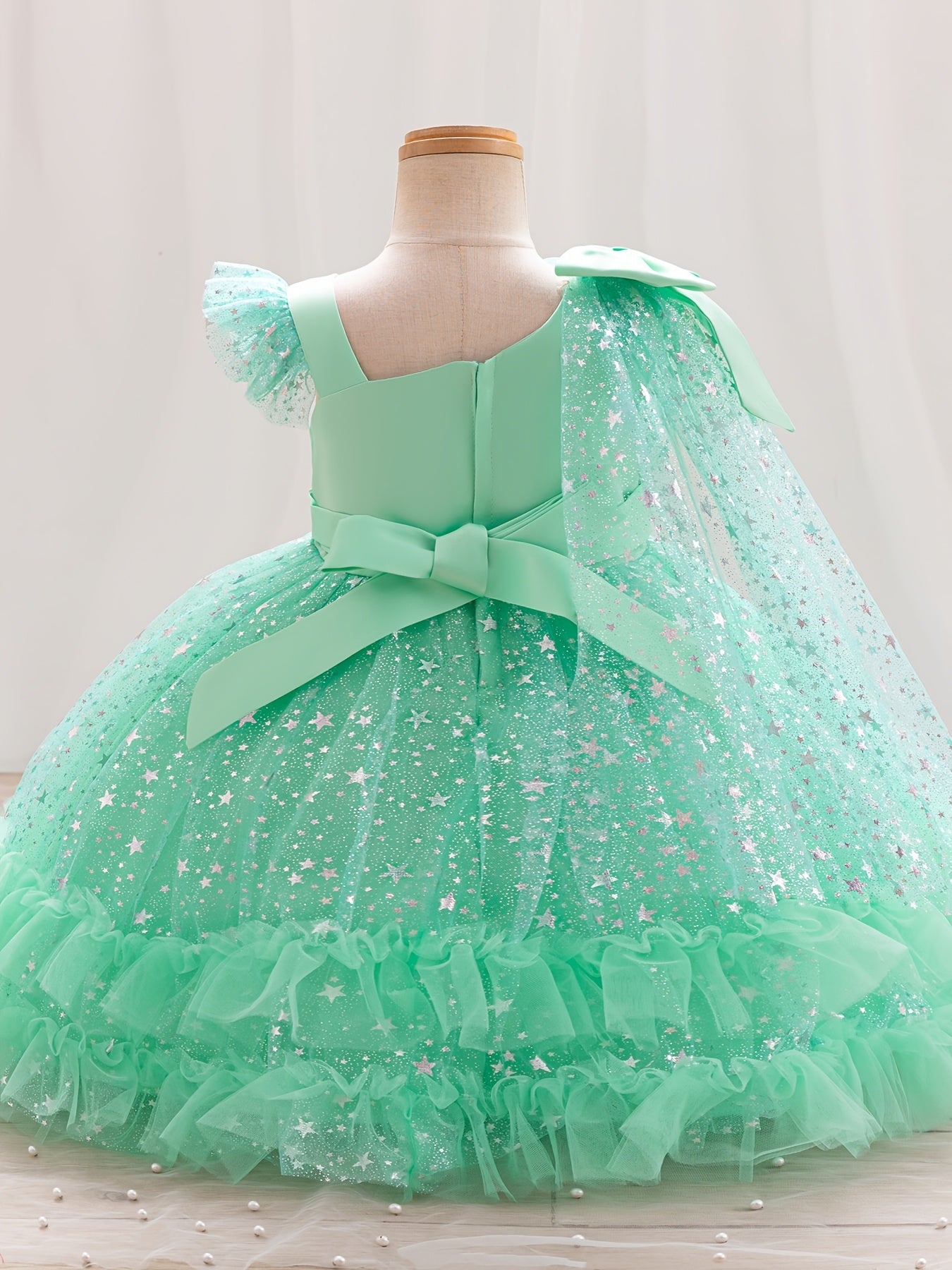 Princess dress for girls with one-shoulder ruffle sleeves, sparkling sequins, and a fluffy design, ideal for weddings, birthdays, and parties.