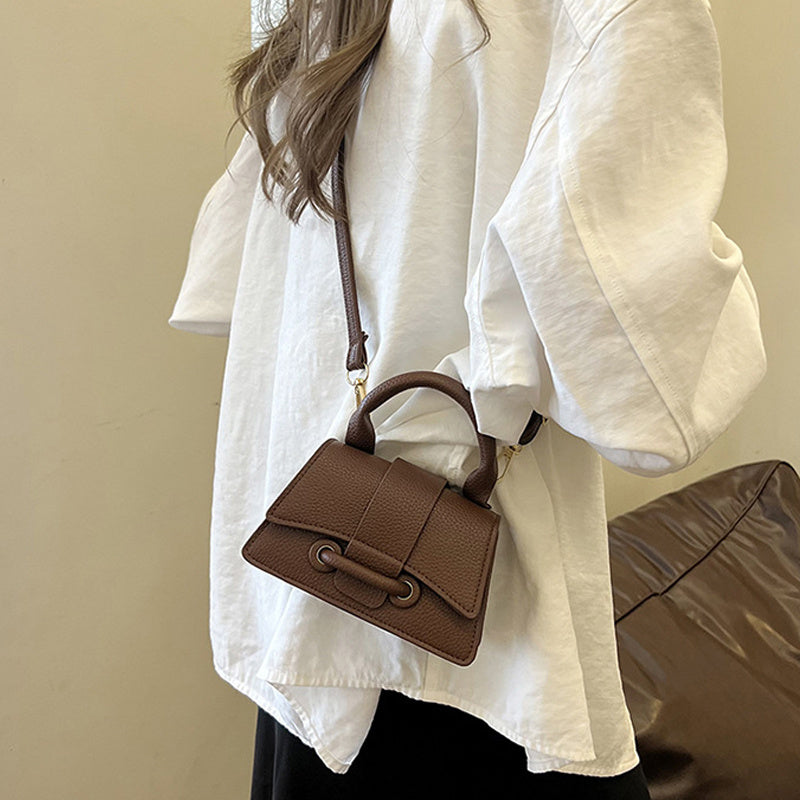 Women's chic mini crossbody bag, small square design in a solid color with magnet closure and adjustable shoulder strap, perfect for daily use and commuting.