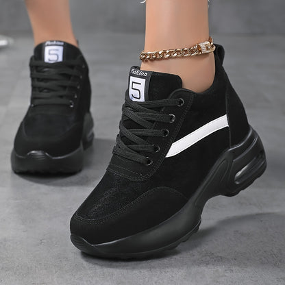 Chunky lace-up sneakers with air cushion for outdoor walks feature hidden heel for added fashion.