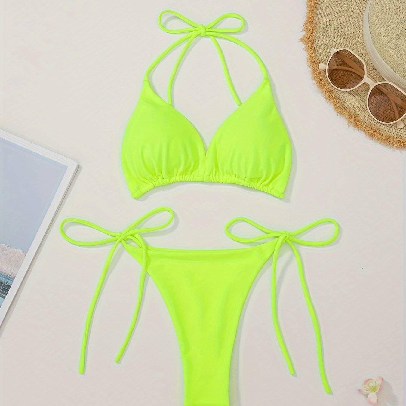 Women's two-piece bikini set with halter bra and V-string bottoms for swimwear.