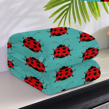 Stay warm and stylish with our cozy ladybug print flannel throw blanket. This soft and versatile blanket is perfect for your couch, bed, office, or travel. It is machine washable and makes a great gift idea for any season.