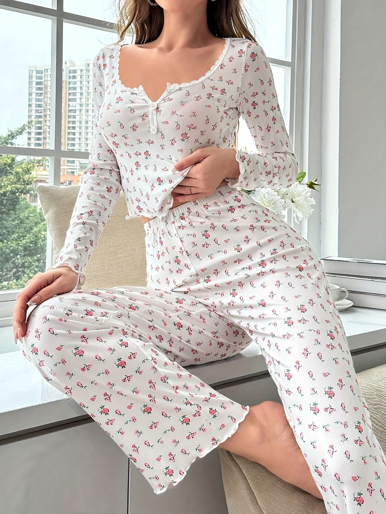 Floral ruffle pajama set for women in cozy polyester knit fabric, perfect for fall/winter lounging.