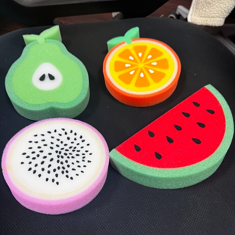 Set of 4 fruit-shaped cleaning sponges made of polyurethane. These multi-purpose scouring pads are perfect for use in the kitchen, bathroom, dishes, car wash, and supermarket. The set includes sponge shapes resembling a pear, orange, dragon fruit, and