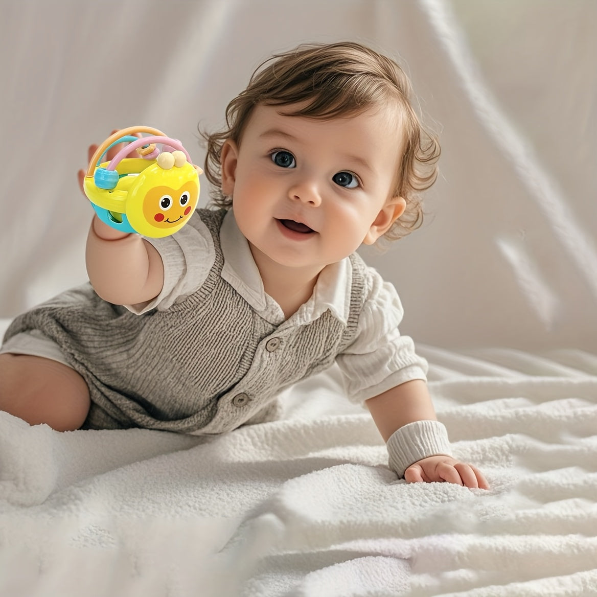 Toys like rattles, gripping toys, teething toys, and handheld balls.