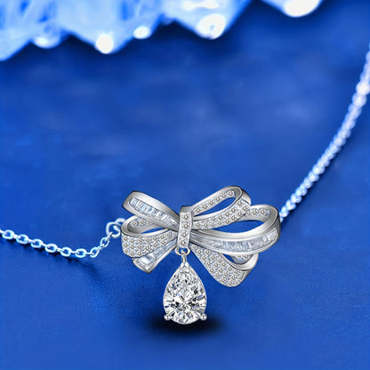 This elegant pendant necklace features 2.0 carats of moissanite in a teardrop tassel bow design, crafted in pure S925 silver. It is a high-end fashion accessory perfect for everyday wear, with its simple and elegant design suitable for parties and as a