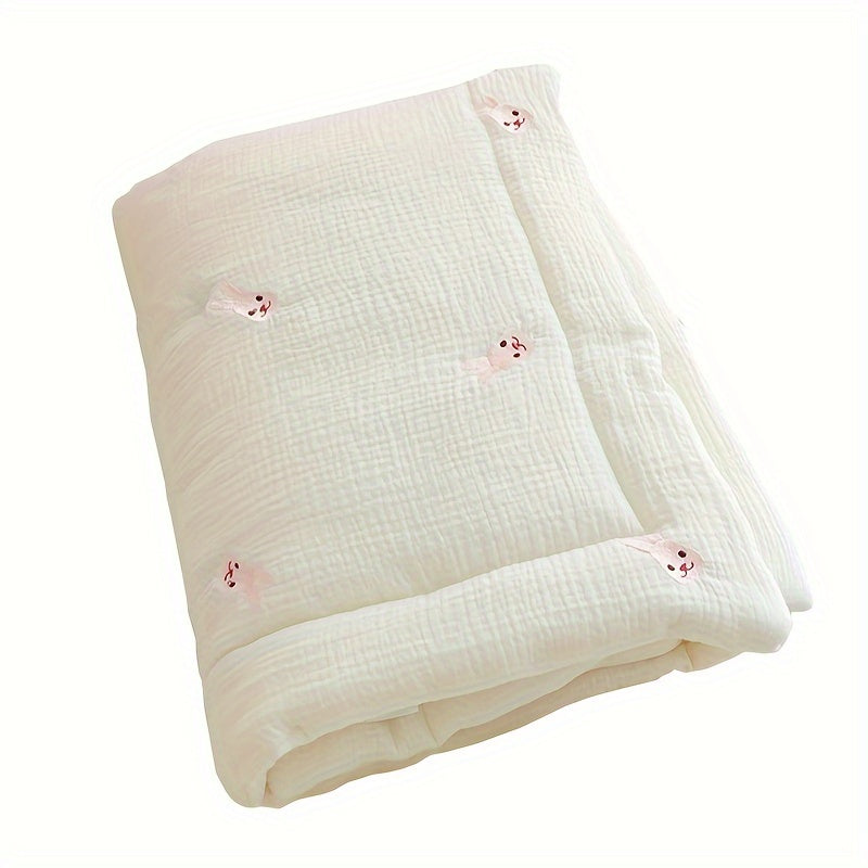 Soft cream-colored quilt with embroidered bear and rabbit, perfect for kids all year round. Made from durable knit fabric for naps and home use.