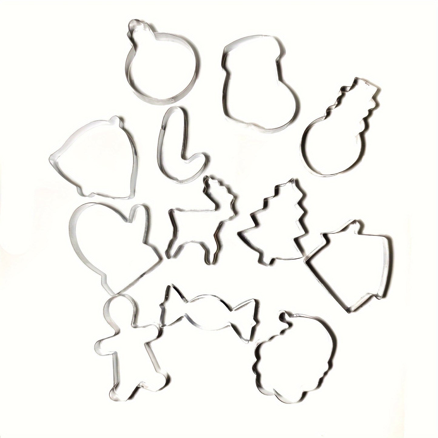 Set of 12 Christmas cookie cutters made of stainless steel, including molds for gingerbread man, candy house, and reindeer. Perfect for holiday baking in the home kitchen.