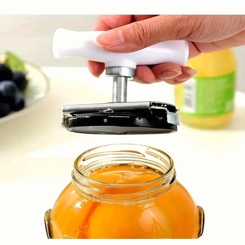 Stainless steel jar opener for easy twist opening of cans and bottles in the kitchen.