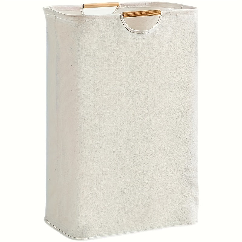 Fabric laundry basket with wooden handles, spacious enough for dirty clothes storage in home, bedroom, or bathroom.