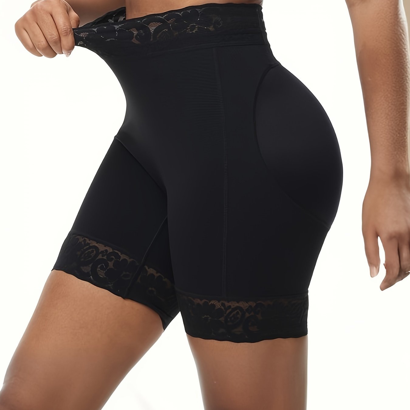 Women's high-waist shaping shorts with lace trim, tummy control, and butt lifting. Made from a breathable nylon/elastane blend with a seamless body sculpting design and floral lace detail.