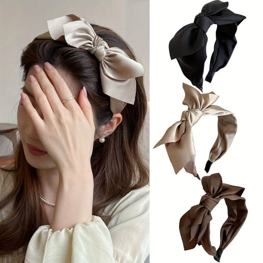 Stylish mesh bow headband for women, perfect for daily wear or parties. Non-feathered material in solid color. Ideal for Women's Day celebrations.