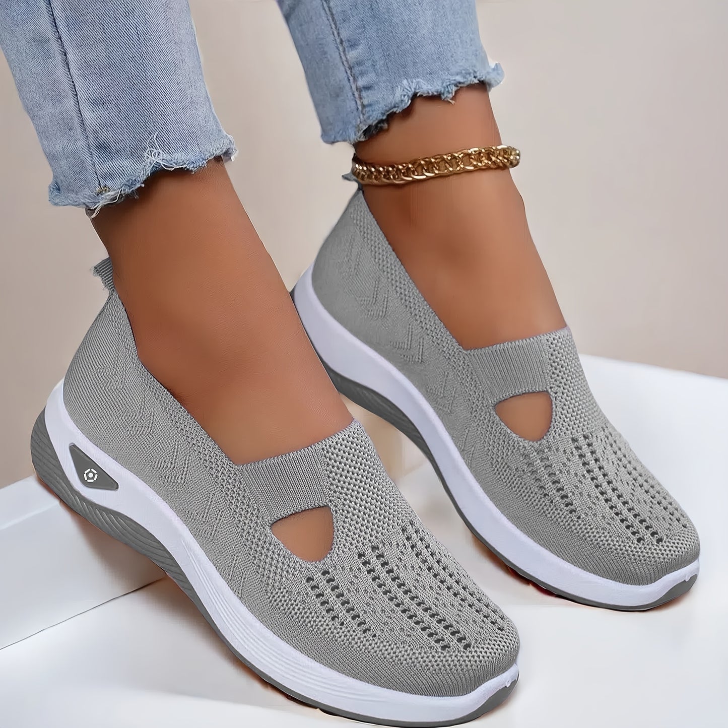 Lightweight and stylish knit sneakers for women in red, beige, green, blue, black, and purple. Features a cut-out design for breathability and a flexible sole for all-season wear.