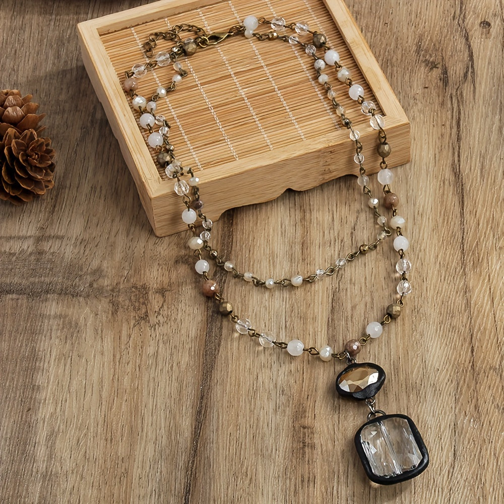 New tribal style necklace featuring two layers of natural stone crystals and glass chains, with a square glass pendant designed for daily wear by both men and women during the spring and summer seasons.