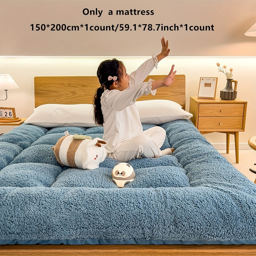 Soft, reversible gray mattress protector with corner straps for easy storage and transport. Ideal for cozy bedrooms.