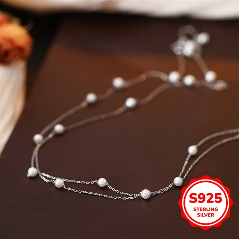 This double-layer pearl necklace is made of 3.02g of S925 sterling silver, giving it a simple and elegant look. The light luxury and high-end design make it perfect for women to wear as a clavicle chain. It is an ideal gift for birthdays, Mother's Day