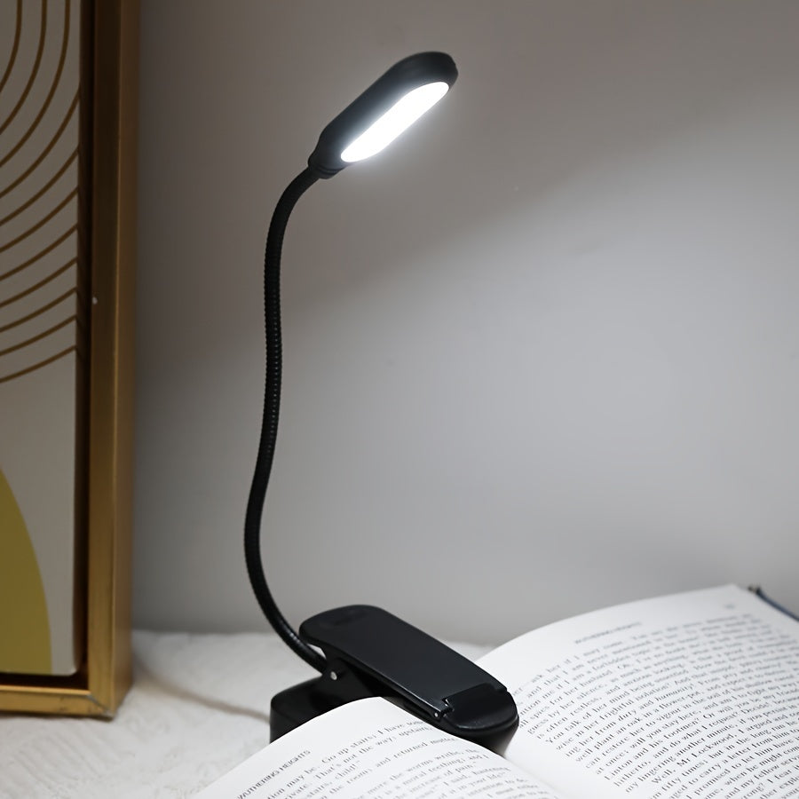 Portable battery-powered clip-on book light for reading that can also be used as a small table lamp or night light for room decor.