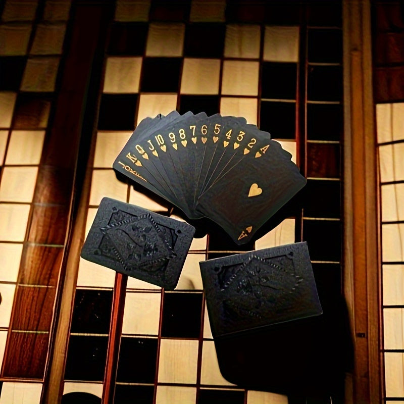 Black gold waterproof playing cards for magic and poker games, packaged in a board game gift collection.