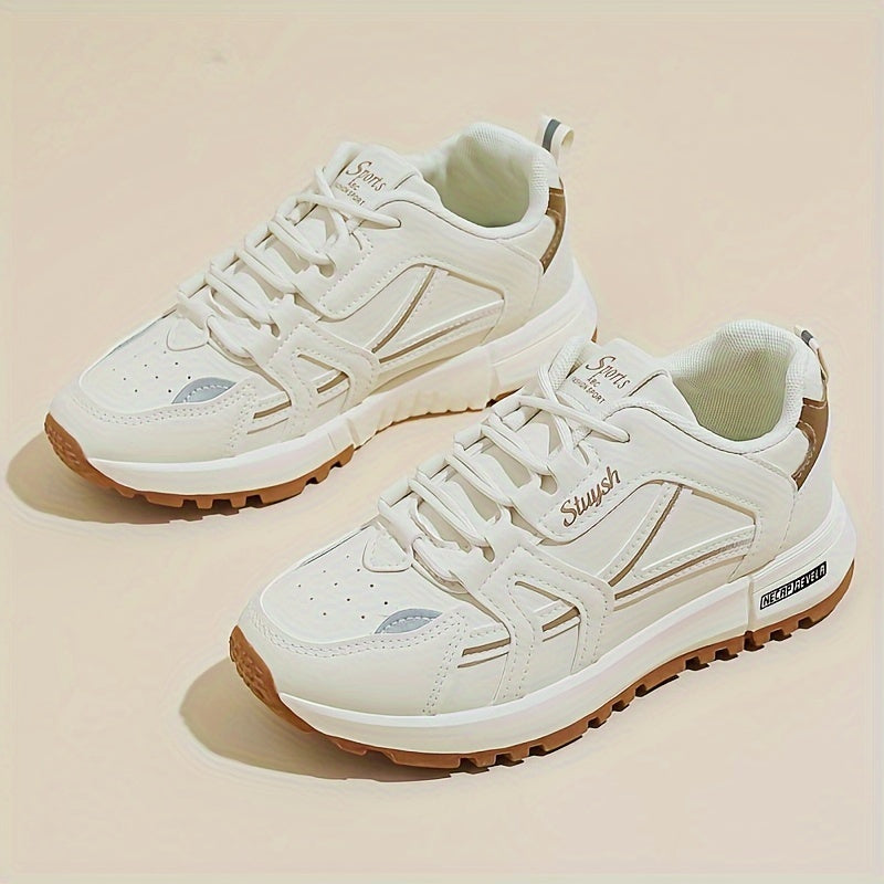 Casual women's running sneakers in white and brown, lace-up low-top design with textured faux leather upper and durable PU sole, comfortable all-season footwear.