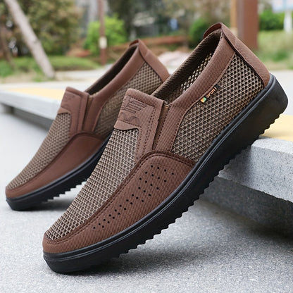 Men's slip-on sneakers with breathable mesh upper, non-slip TPU sole, comfortable fabric insole, solid black design with hook & loop fastener for all-day comfort.