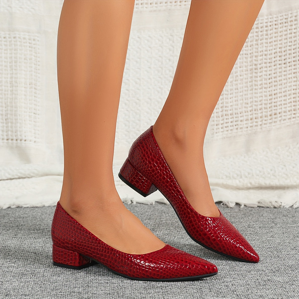 Stylish red snakeskin pattern pumps with pointed toe, low heel, and lightweight PU cover - perfect for weddings and parties. versatile and comfortable design for ladies.