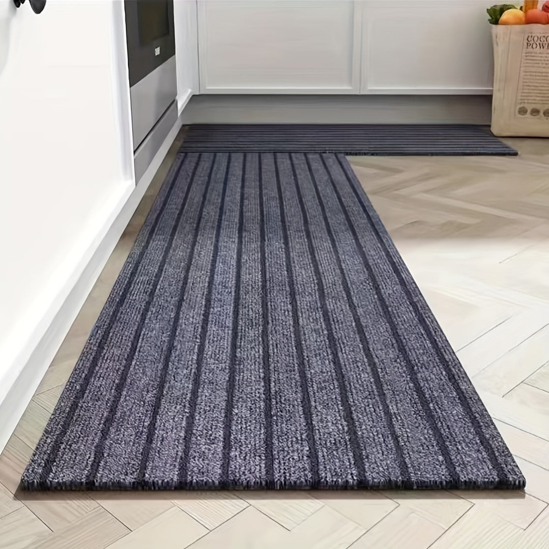 One piece of rectangular kitchen carpet measuring 1.8m x 0.9m. Features include non-slip, oil resistant, waterproof, and easy to maintain polyester fiber material with low pile. The carpet is machine washable and has a striped pattern, making it a