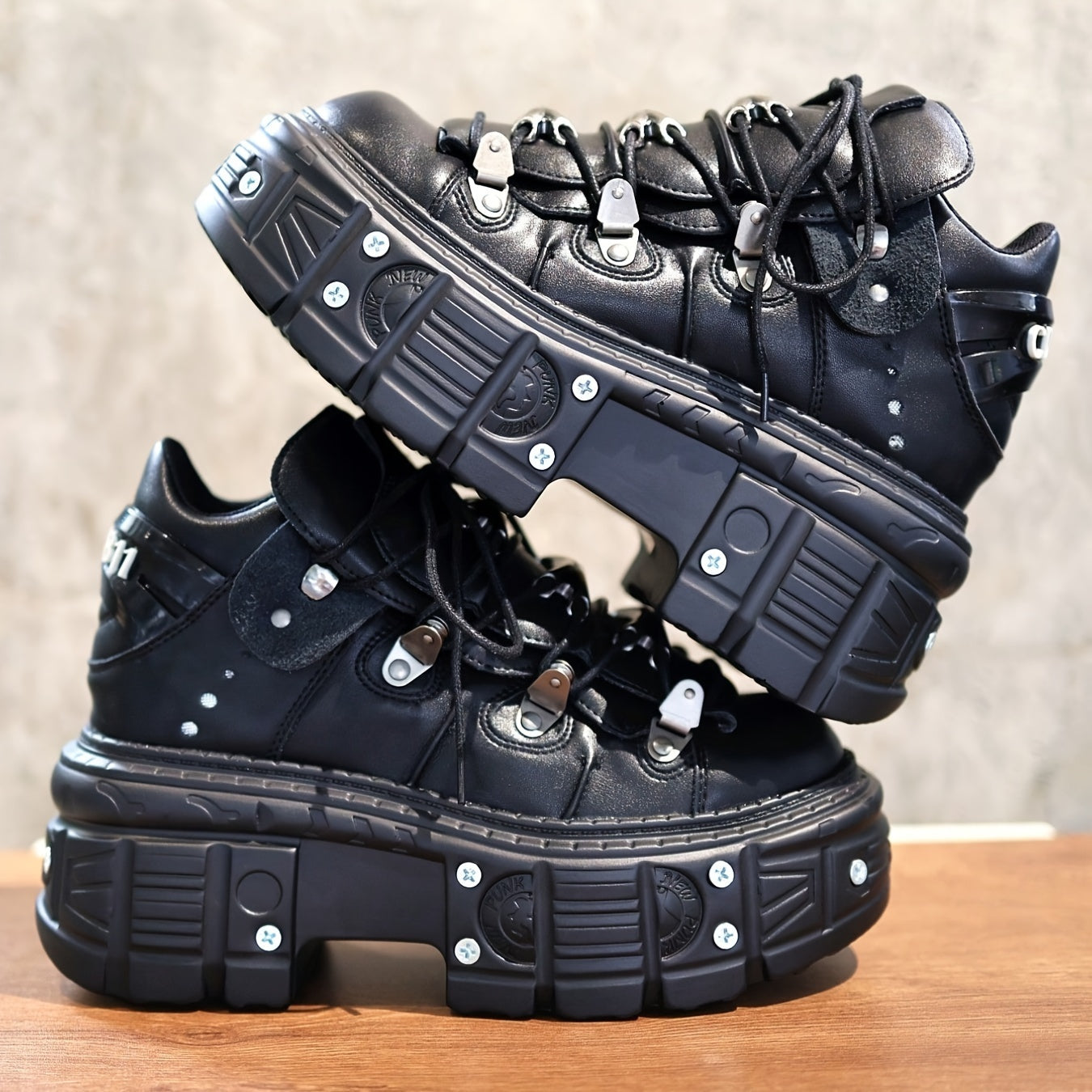 Black women's mid-top sneakers with metallic accents, waterproof, thick platform sole, lace-up Y2K goth style.