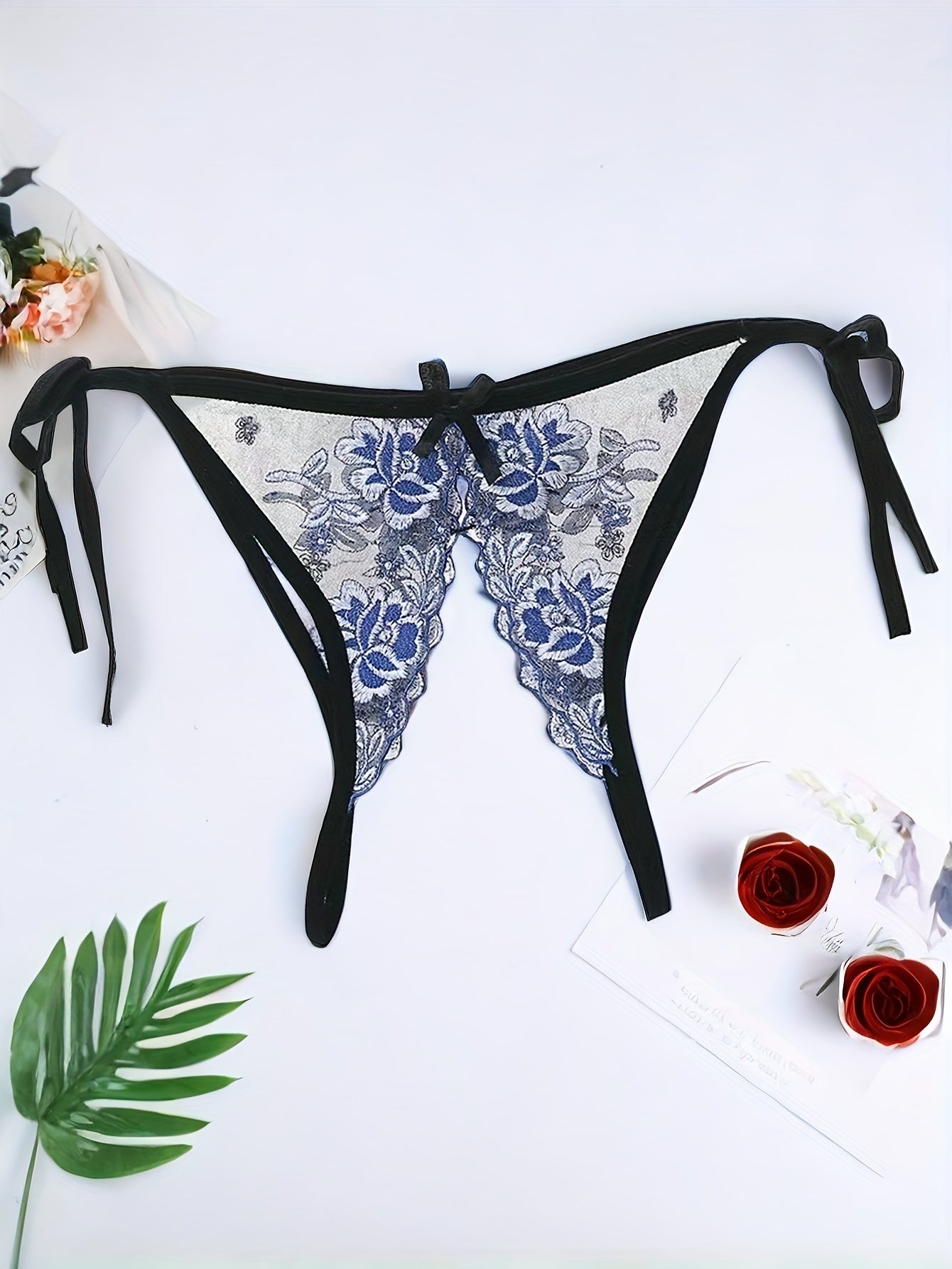 Elegant embroidered floral thong panties with garter straps, adjustable slit, knit fabric, polyamide, for adults.