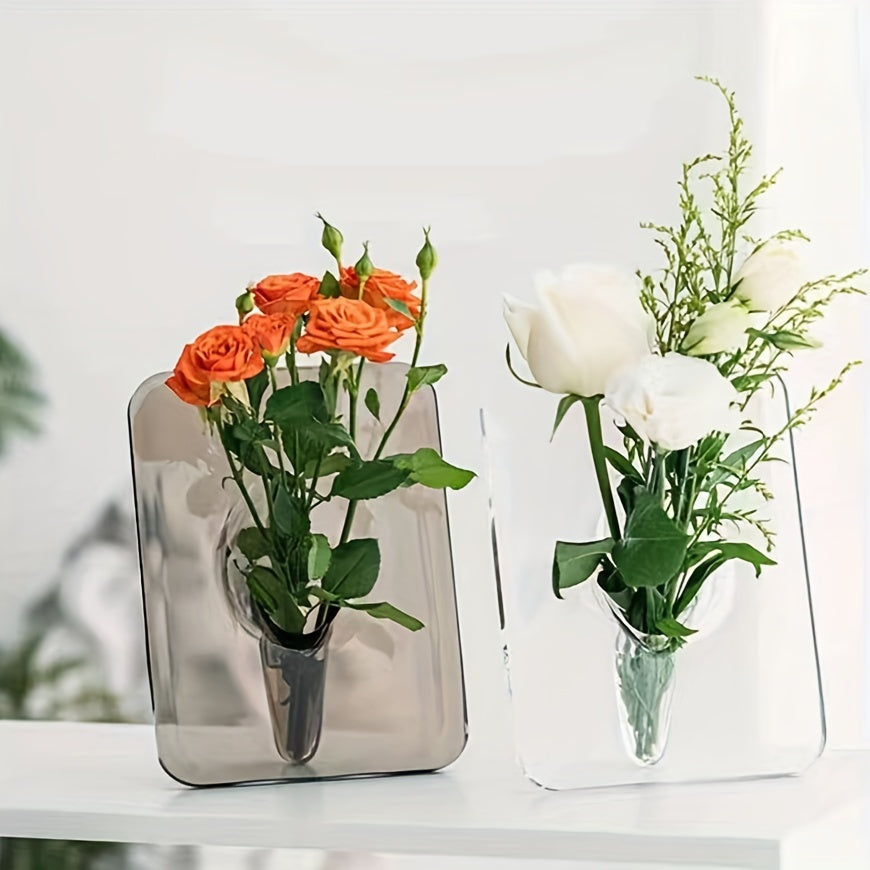 Art Deco-style acrylic resin bud vase with geometric transparent oblong design. Doubles as a creative picture frame. Ideal for home or office décor. Makes a great small gift (flowers not included).