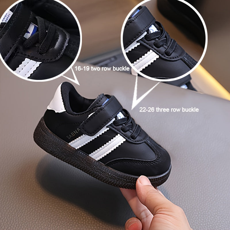 Minimalist unisex toddler sneakers with solid color, adjustable strap closure, slip-resistant sole, and breathable fabric.