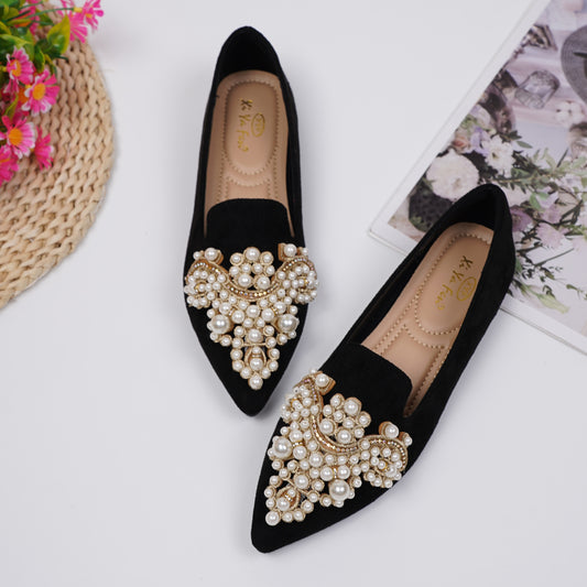 Women's elegant flat shoes with faux pearl decoration, point toe design, and lightweight comfort.