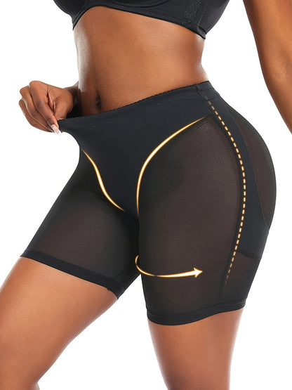 Slimming black shapewear shorts with high waist, tummy control, mesh panels, and a golden zipper detail. Made from a stretchy blend of polyester and elastane, providing mid-support.