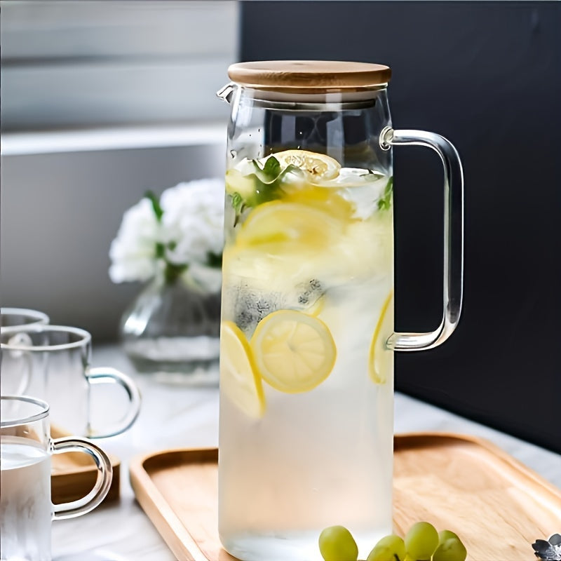 Glass cold water pitcher with bamboo lid, available in 1000ml or 1500ml sizes, round shape, hand wash only, suitable for chilled beverages - for adults.