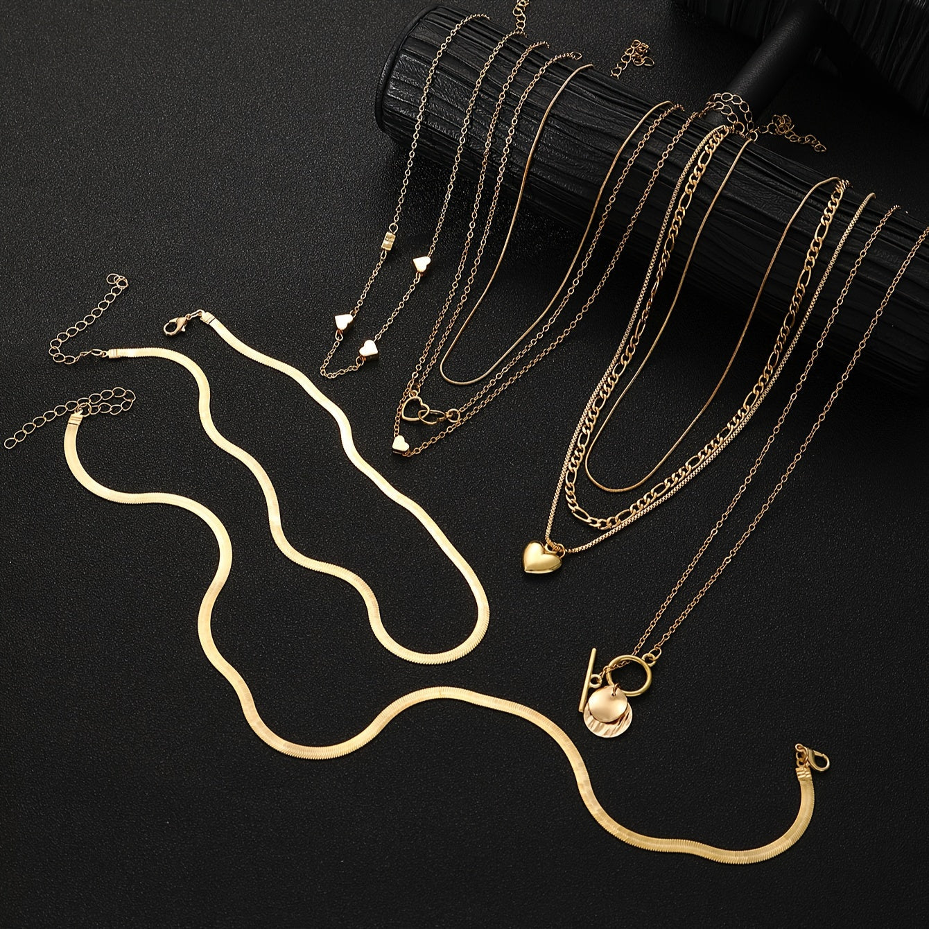 This stylish necklace set features 10 pieces with vintage heart and geometric pendants, complete with a snake chain and OT clasp. Ideal for everyday wear, special occasions, and gifting, this pendant necklace is the perfect accessory.