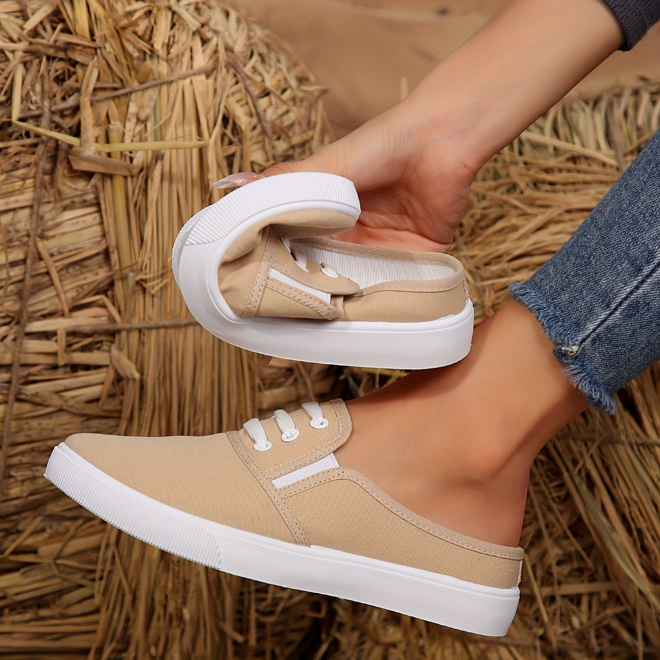 Lightweight white slip-on canvas sneakers for women with a soft sole and minimalist design.