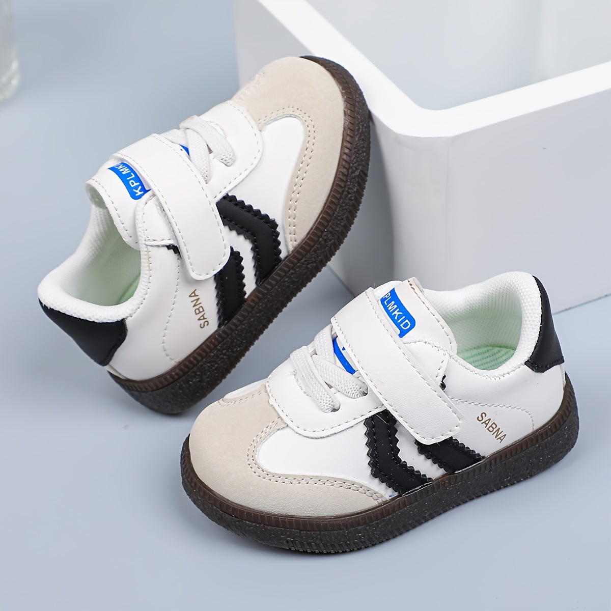 Versatile Boy's and Girl's Casual Sneakers for Spring and Summer. White and black shoes that are comfortable, lightweight, slip-resistant, and stylish for school.