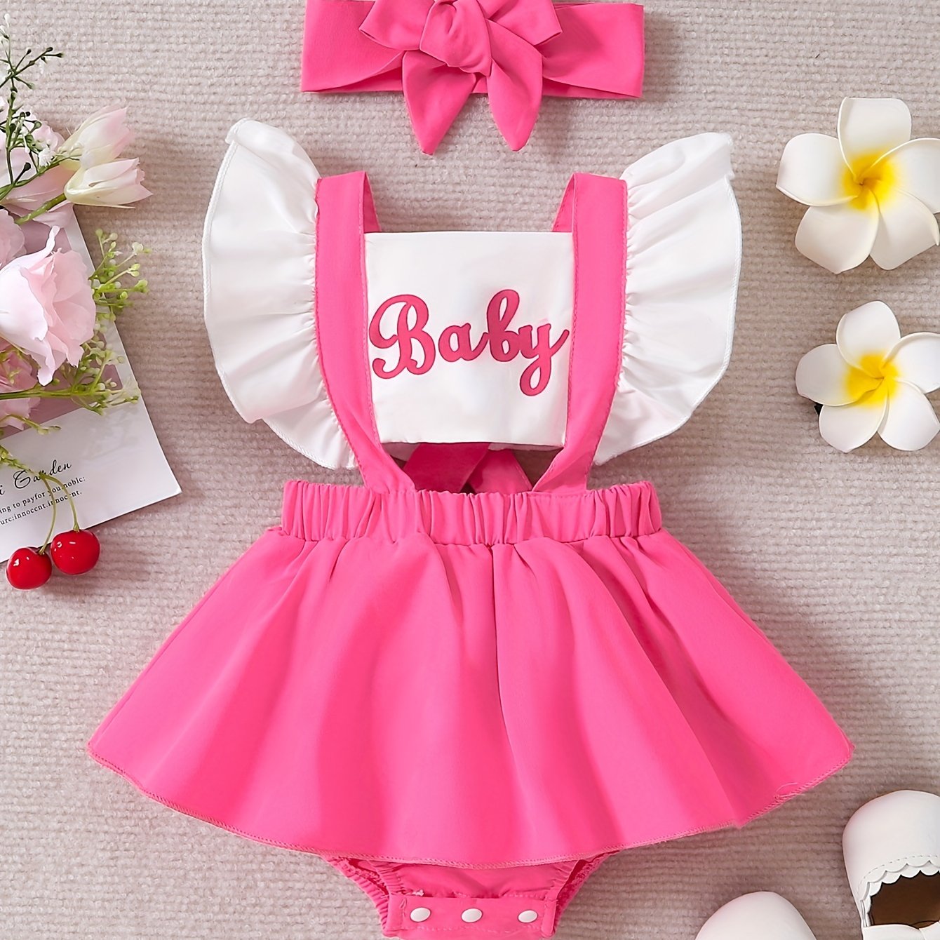 Sweet baby romper dress with cute color contrast letter print and flying sleeves.