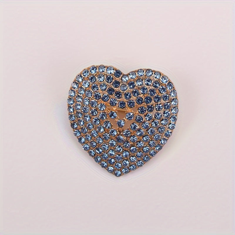 Heart-shaped brooch embellished with sparkling rhinestones - a stylish lapel pin for women's attire, perfect for adding charm to dresses, coats, sweaters, and corsages.