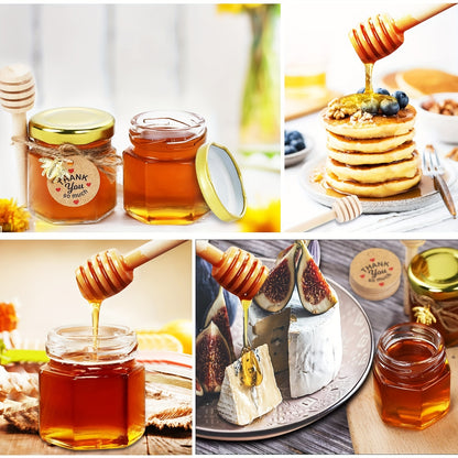 Small hexagonal glass honey jars come in 1.5 oz sizes in sets of 20, 30, 50, or 60. Each jar includes a spoon, bee symbol, and thank you card. They have golden lids and are ideal for baby gifts, weddings, and parties.