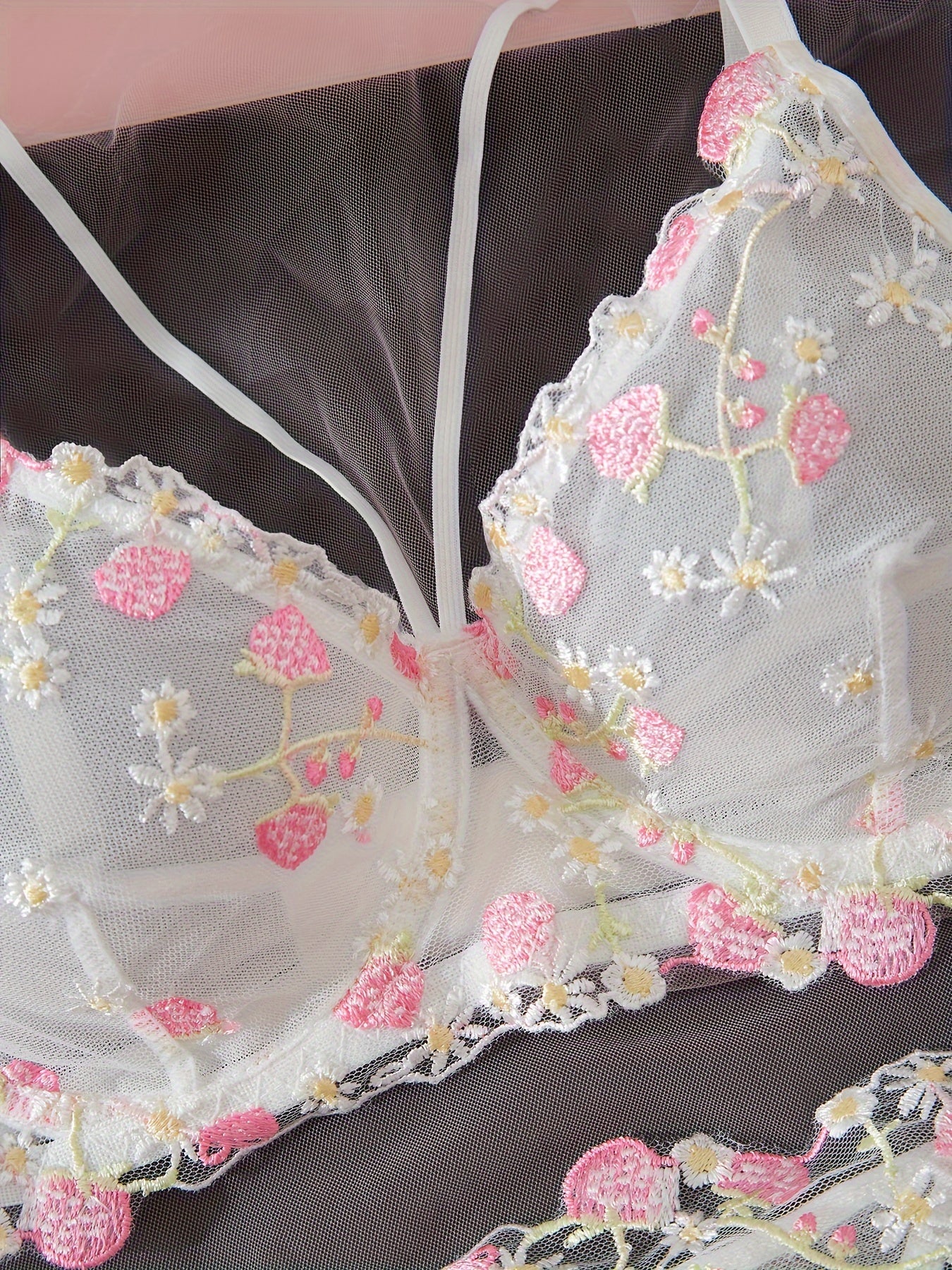 Floral embroidered chest straps cami bra and thongs lingerie set for women.