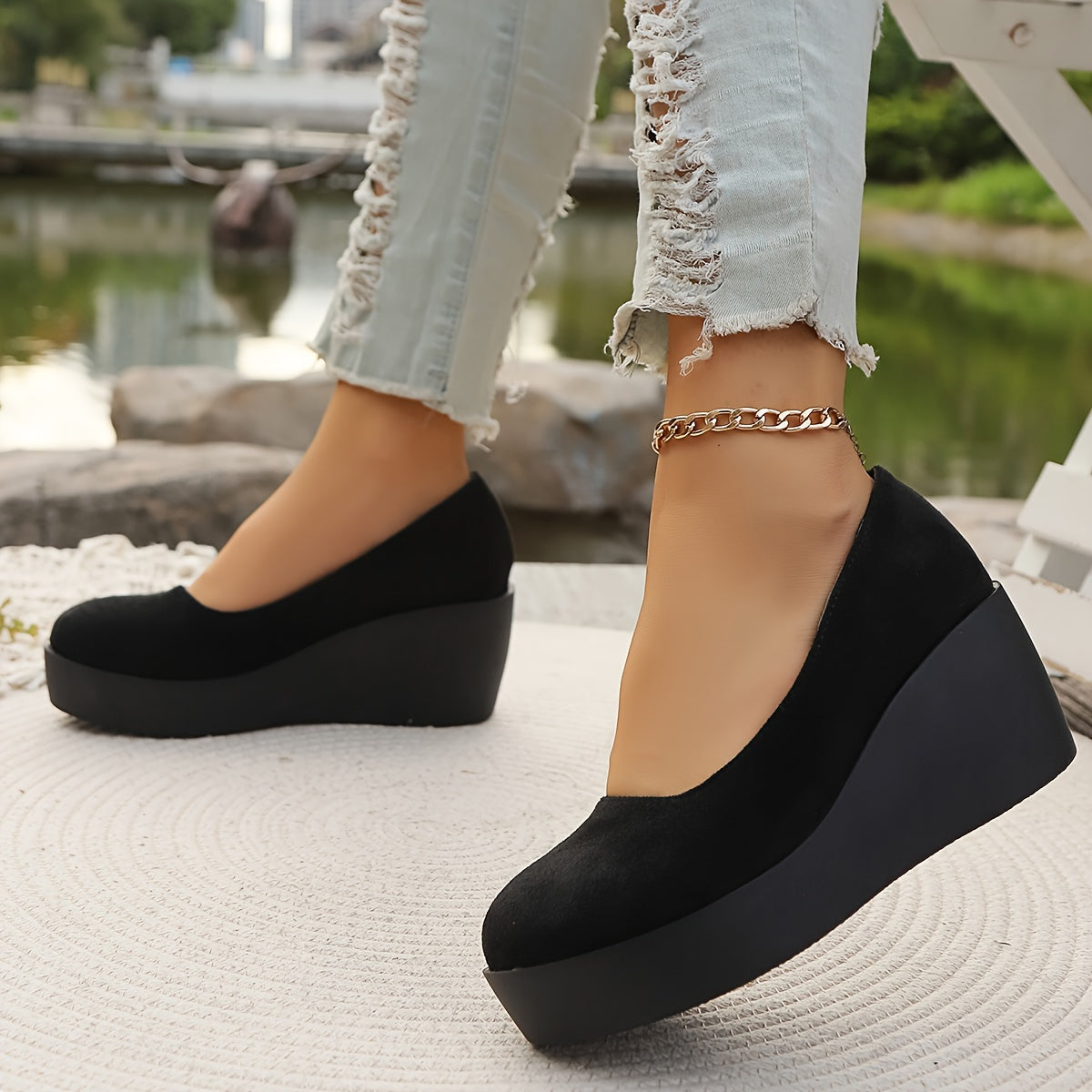 Women's stylish black slip-on platform wedge loafers for casual daily wear.