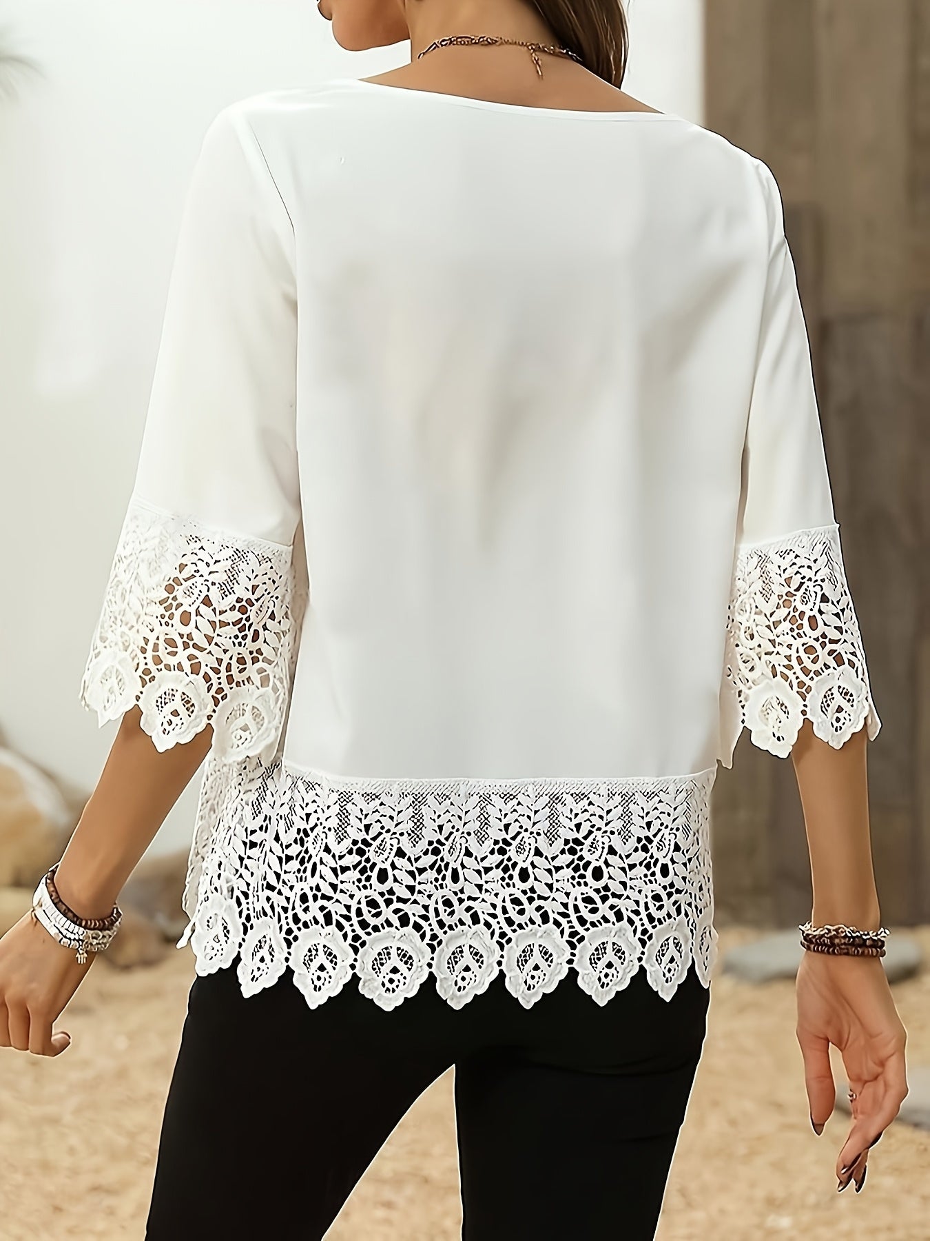 Elegant white plus size blouse for women made of polyester. Features round neck and half sleeves, ideal for spring and summer wear.