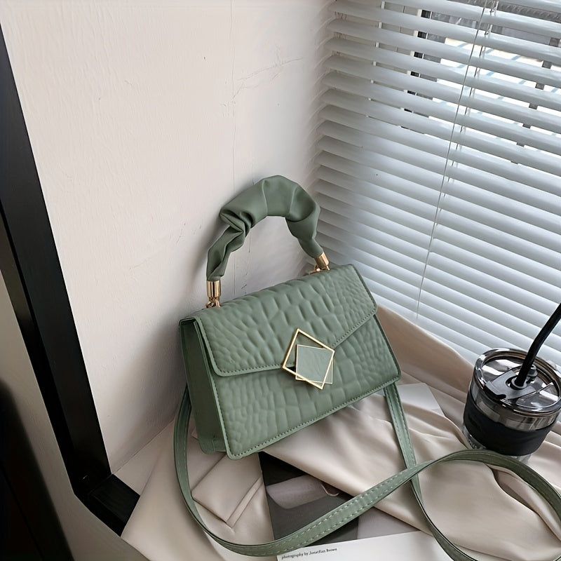 This women's fashion satchel is made of faux leather in a solid color with a buckle closure and edge paint. It includes an accessory and is occasion-ready. Do not wash.