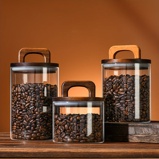 Glass food storage container with lid that is versatile and dishwasher safe. Ideal for storing coffee beans, candy, cookies, noodles, nuts, and spices. Available in 650ml or 1100ml capacity.